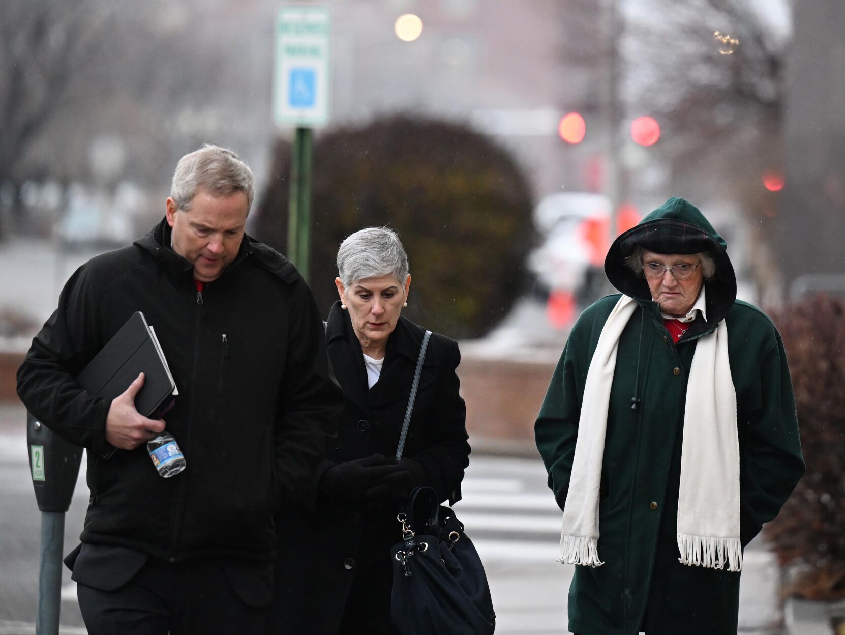 <p>Shirley Koch, right, looks down as she arrives to the Wayne Aspinall Courthouse with her attorneys for the sentencing hearing for her and her daughter Megan Hess on Tuesday in Grand Junction, Colorado.</p>