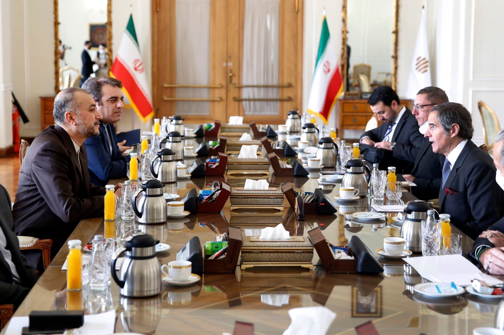 <p>International Atomic Energy Agency Director-General Rafael Mariano Grossi, right, speaks with Iran's Foreign Minister Hossein Amirabdollahian, left, during their meeting March 5, 2022, in Tehran.</p>