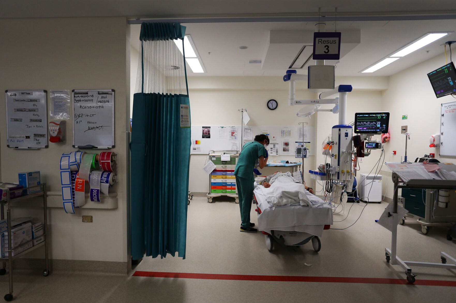 <p>Emergency department registrar Jenny Sze checks in with a patient Dec. 4, 2021, at St. Vincent's Hospital's emergency department in Sydney, Australia.</p>