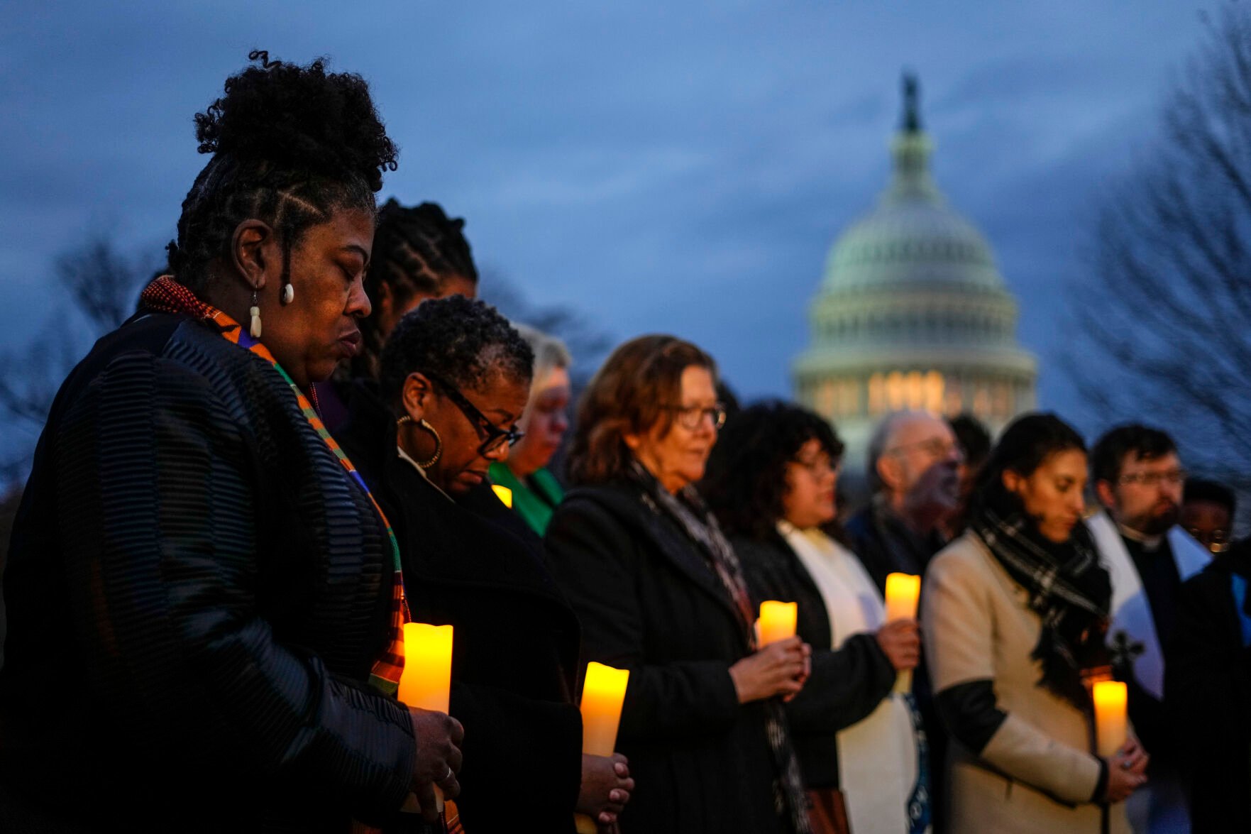 <p>The Rev. Dr. Cassandra Gould, left, gathers with other Christian leaders for a prayer vigil Friday on Capitol Hill in Washington to mark the second anniversary of the Capitol riot.</p>