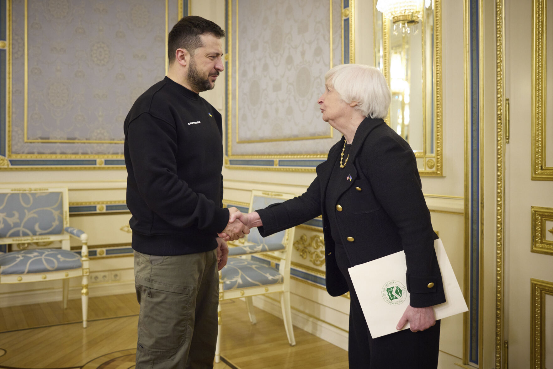 <p>Ukrainian President Volodymyr Zelenskyy, left, and U.S. Treasury Secretary Janet Yellen shake hands during their meeting in Kyiv, Ukraine, Monday, Feb. 27, 2023. (Ukrainian Presidential Press Office via AP)</p>