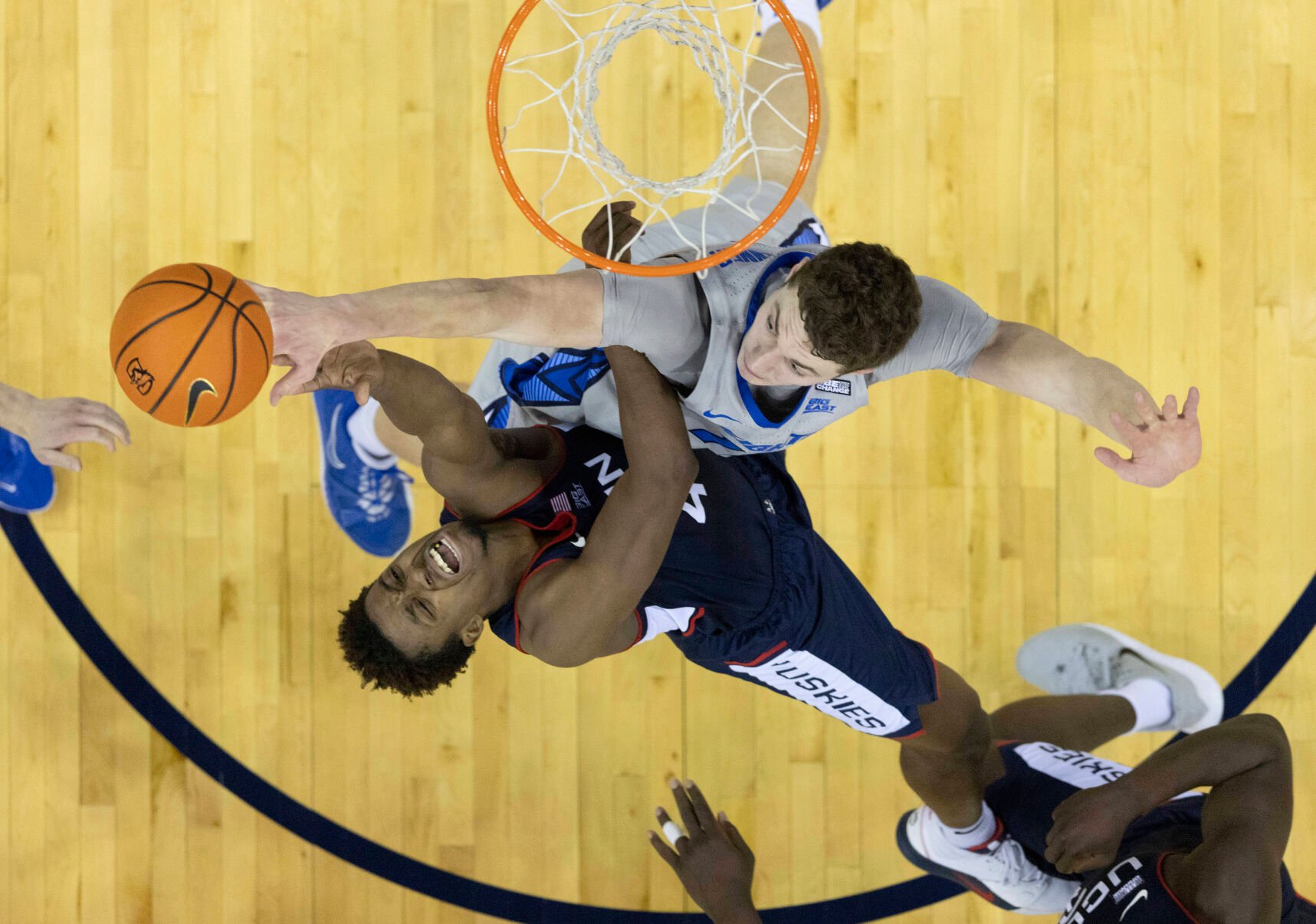 <p>UConn's Nahiem Alleyne, left, shoots against Creighton's Ryan Kalkbrenner during the first half of Saturday's game in Omaha, Neb.</p>