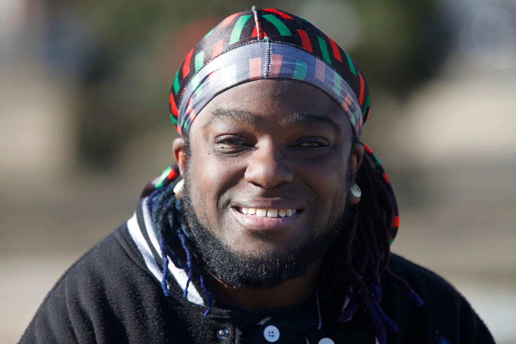<p>Luc Bensimon, an activist for the Black Trans Advocacy Coalition, pauses during an interview about transgender rights issues on Feb. 10 in his hometown of Topeka, Kansas. Bensimon says a bill being considered by Kansas legislators to define male and female in state law based on people's anatomy at birth will cause panic among fellow transgender people.</p>