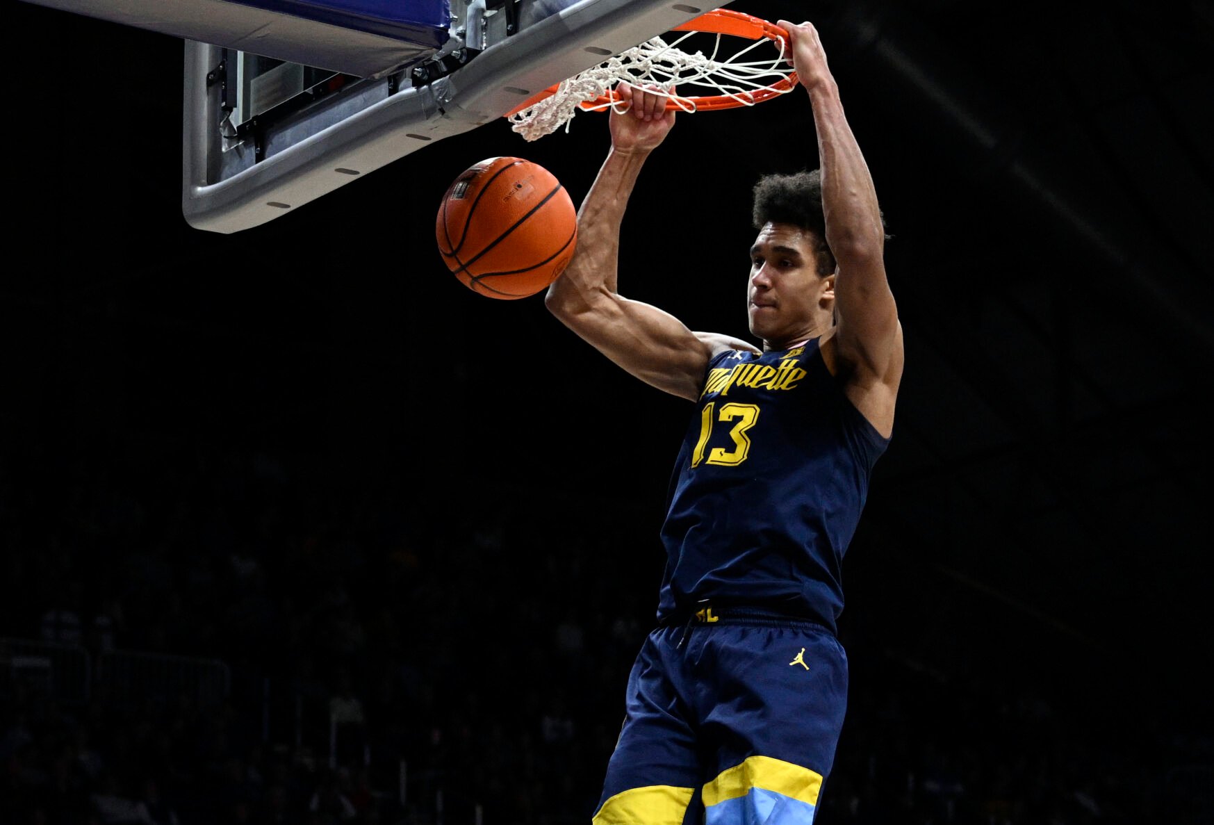 <p>Marquette forward Oso Ighodaro dunks the ball during the second half of Tuesday's game against Butler in Indianapolis. </p>