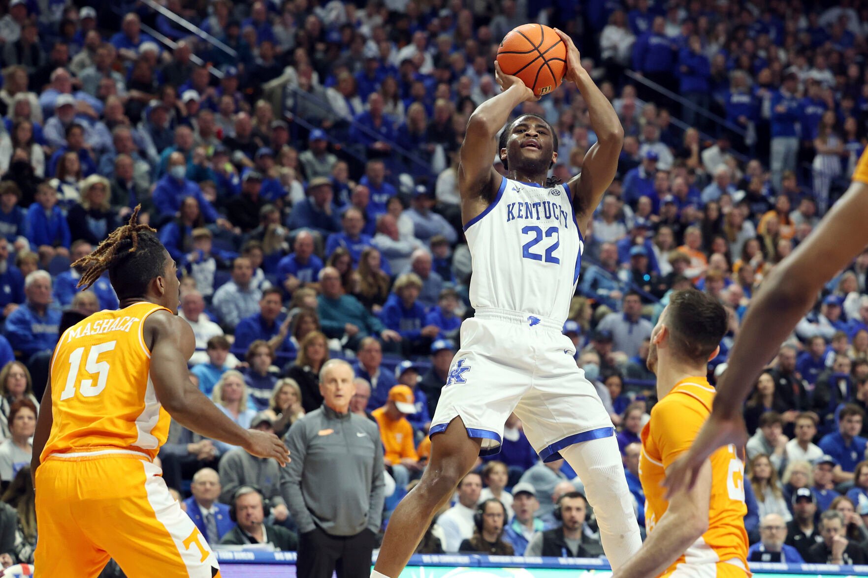 <p>Kentucky's Cason Wallace shoots between Tennessee's Jahmai Mashack and Santiago Vescovi, right, during the first half of Saturday's game in Lexington, Ky.</p>