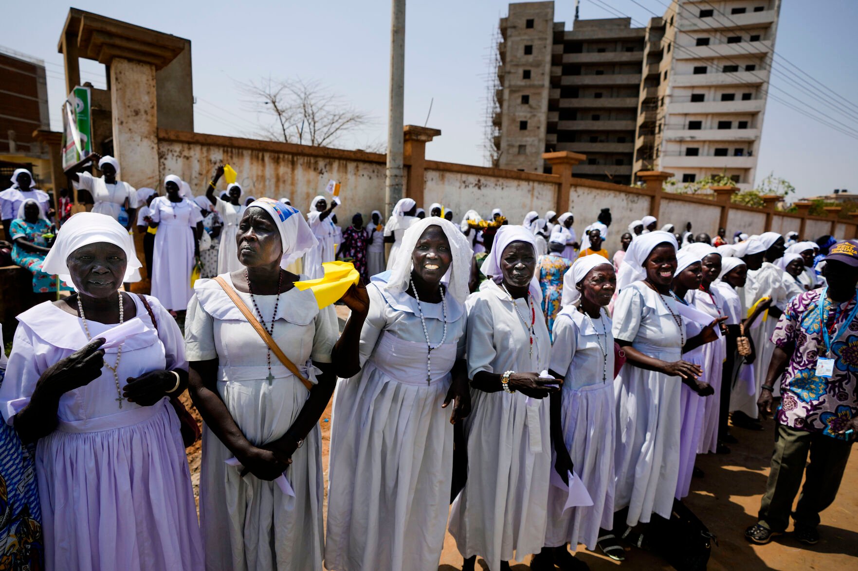 <p>Faithful and nuns wait Friday for the arrival of Pope Francis in Juba, South Sudan.</p>