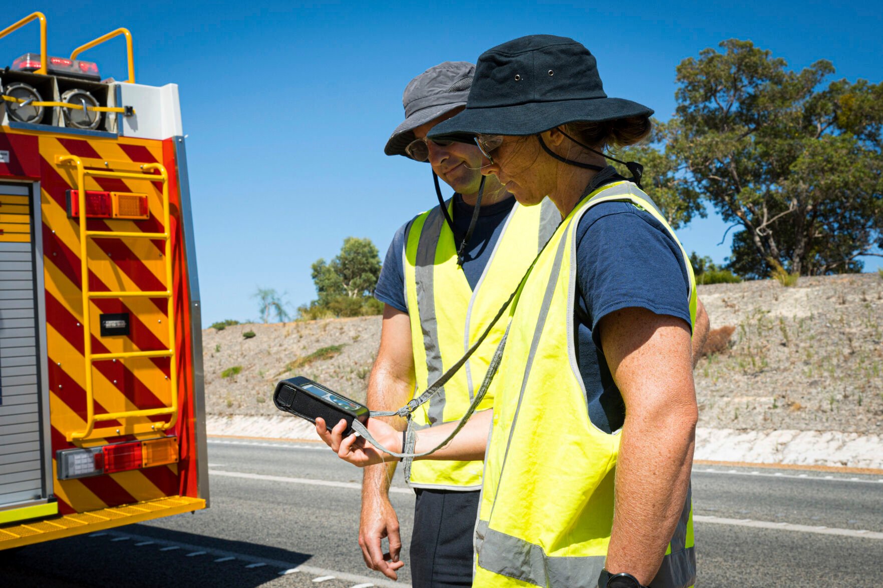 <p>Members of the Department of Fire and Emergency Services search Saturday for a radioactive capsule on the outskirts of Perth, Australia.</p>