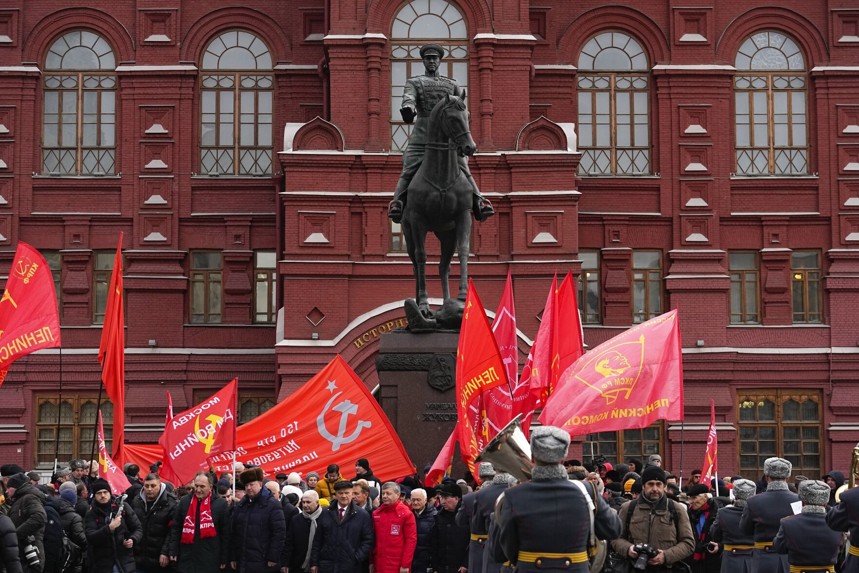 <p>Communist's party supporters with Red flags gather Thursday around the statue of Soviet Marshal Georgy Zhukov after a wreath-laying ceremony at the Tomb of the Unknown Soldier near the Kremlin Wall in Moscow as Russia marks the 80th anniversary of the Soviet victory in the battle of Stalingrad.</p>