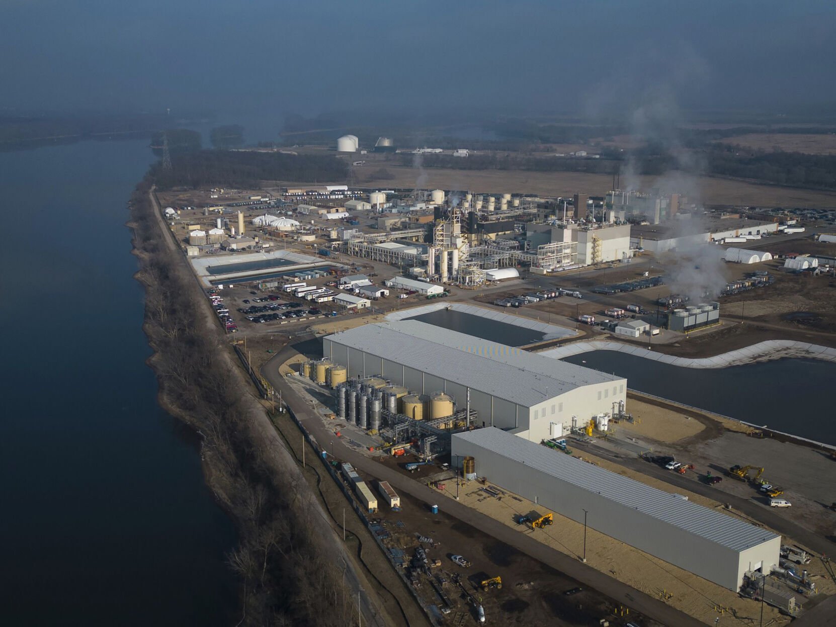 <p>3M's Cordova chemical plant Dec. 7, 2022, on the Mississippi River upstream from the Quad Cities. The company dumps highly toxic PFAS chemicals into the river.</p>