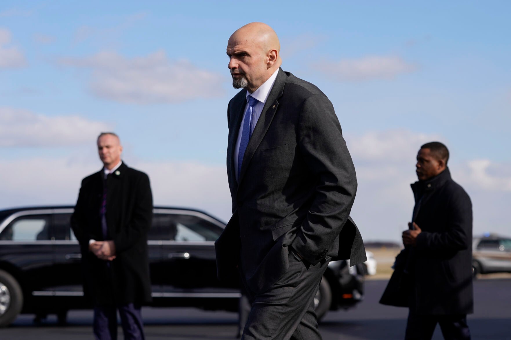 <p>FILE - Sen. John Fetterman, D-Pa., walks to a motorcade vehicle after stepping off Air Force One behind President Joe Biden, Feb. 3, 2023, at Philadelphia International Airport in Philadelphia.</p>