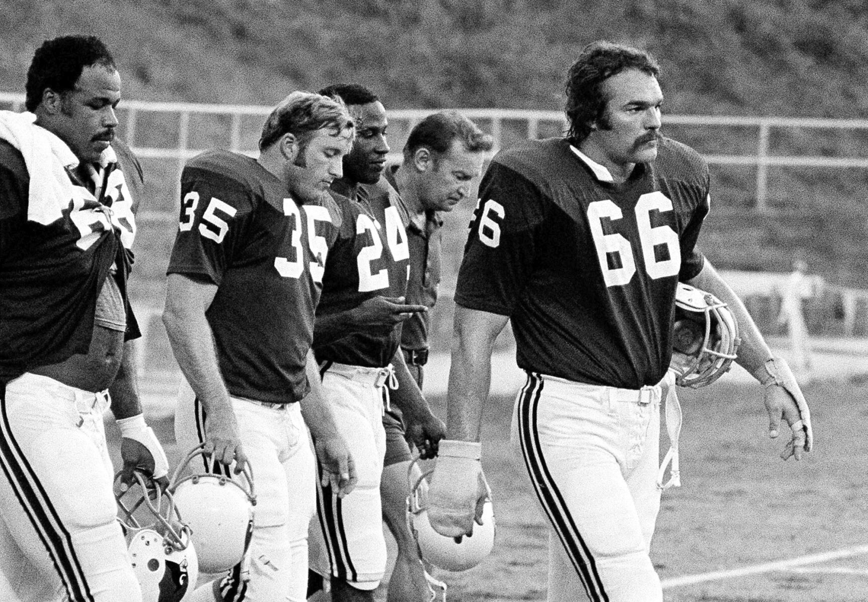<p>St. Louis Cardinals' Conrad Dobler (66) leads the march off the field at the end of practice during training camp in 1977 at St. Charles, Mo.</p>