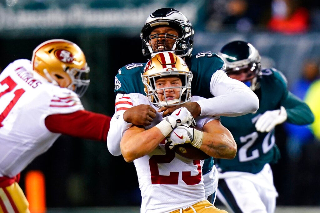 <p>San Francisco 49ers running back Christian McCaffrey is tackled by Philadelphia Eagles defensive end Robert Quinn during the second half of the Jan. 29 NFC Championship between the Philadelphia Eagles and the San Francisco 49ers in Philadelphia.</p>