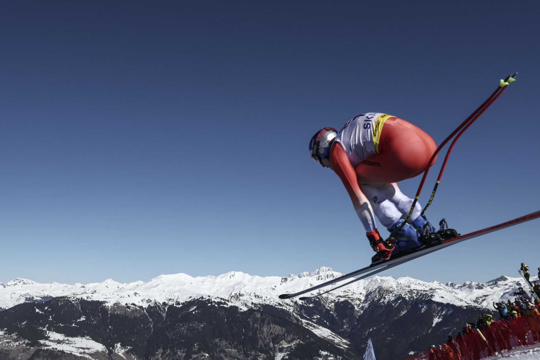 <p>Switzerland's Marco Odermatt is airborne as he speeds down the course during the alpine ski, men's World Championship downhill, on Sunday in Courchevel, France.</p>