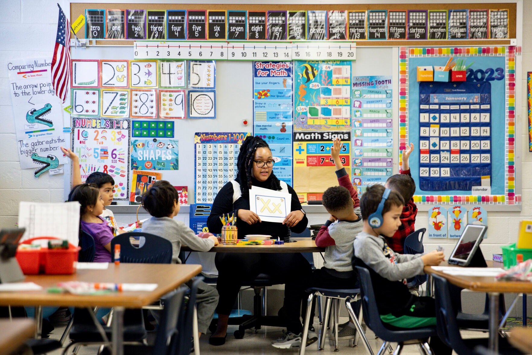 <p>Student teacher Lana Scott, who plans to graduate from Bowie State University in the spring of 2023, teaches a small group of kindergartners at Whitehall Elementary School the alphabet, Tuesday, Jan. 24, 2023, in Bowie, Md. </p>
