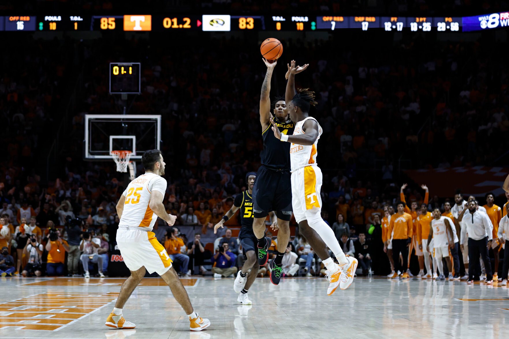 <p>Missouri guard DeAndre Gholston takes a last-second 3-point shot over Tennessee guard Jahmai Mashack, right, during the second half of Saturday's game in Knoxville, Tenn.</p>