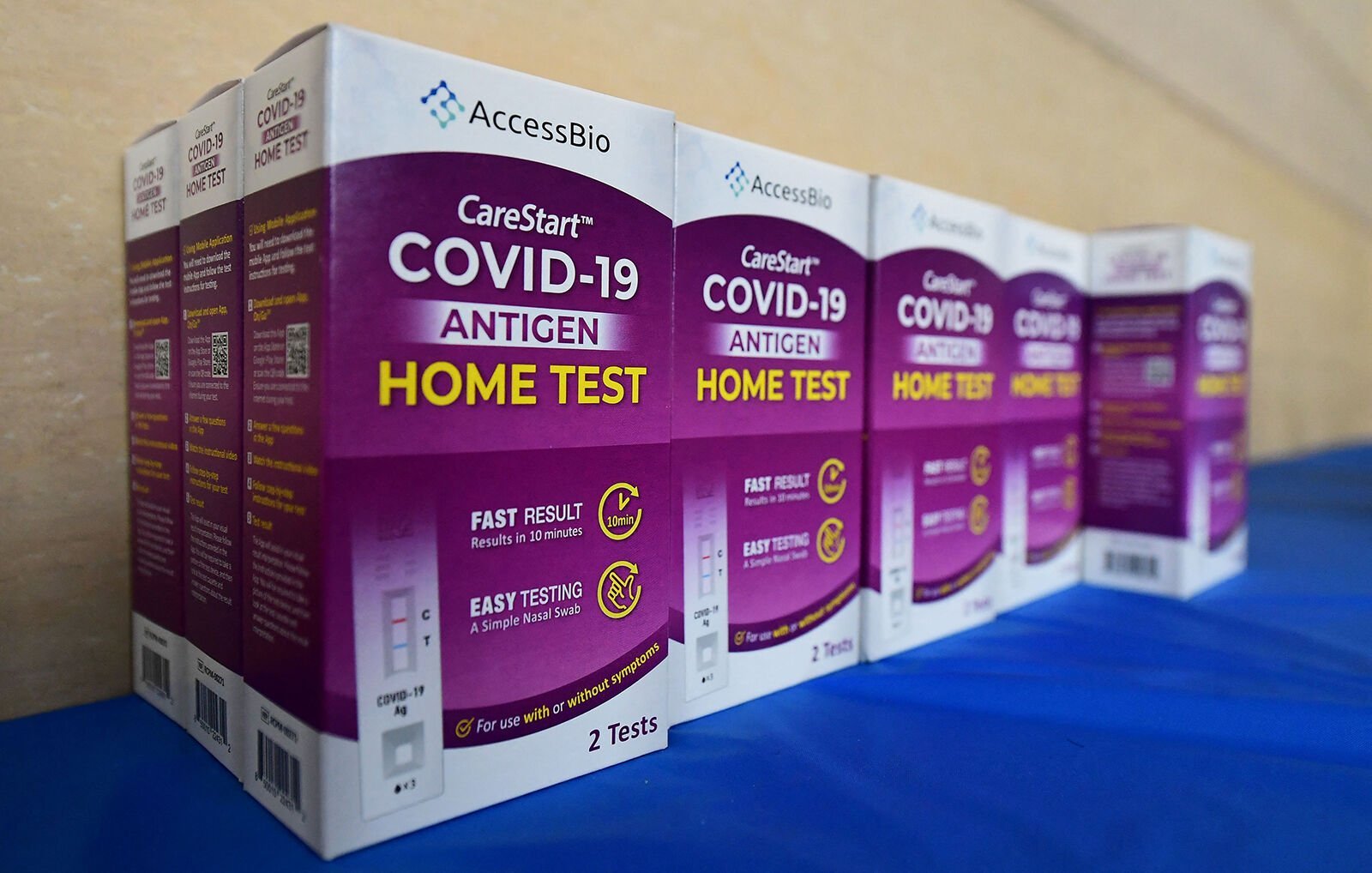 <p>Rapid COVID-19 test kits await distribution Jan. 7, 2022, to people receiving their COVID-19 vaccines or boosters at Union Station in Los Angeles.</p>