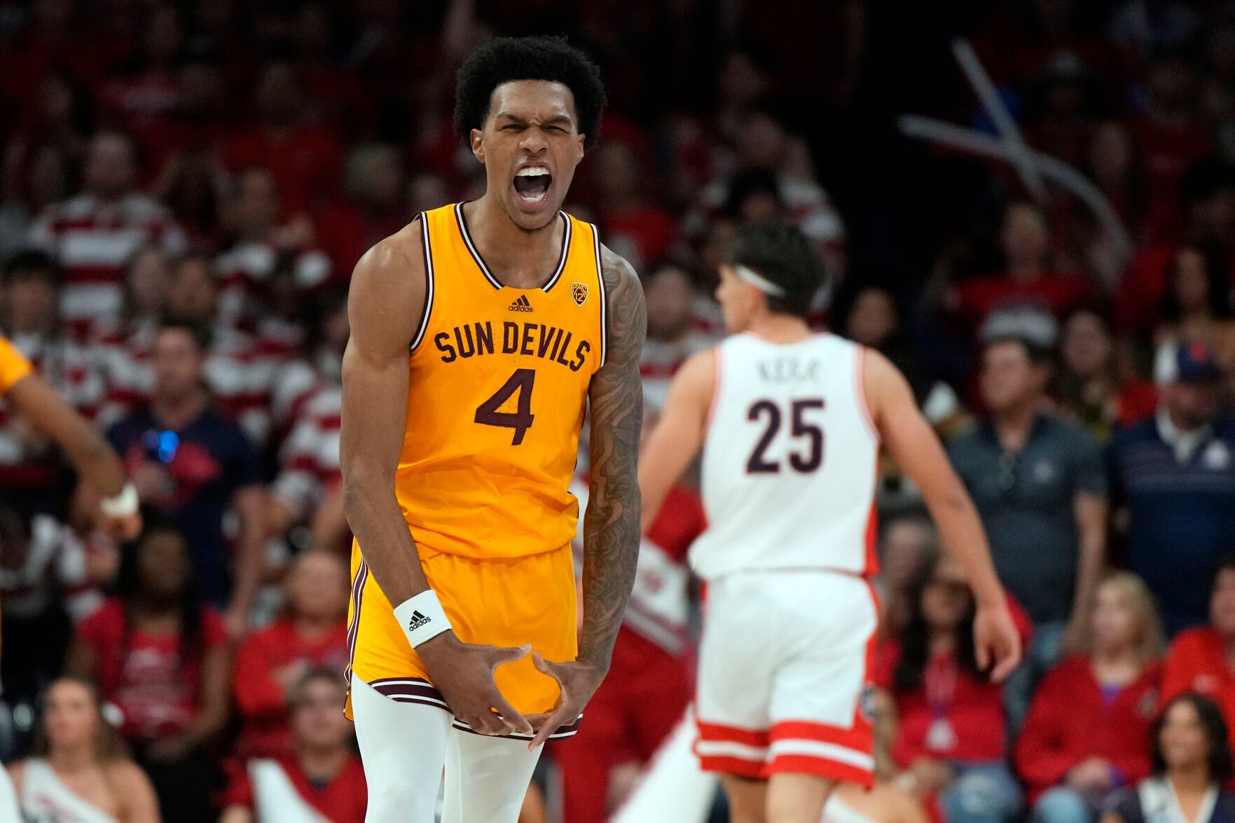 <p>Arizona State guard Desmond Cambridge Jr. reacts after scoring against Arizona during the second half of Saturday's game in Tucson, Ariz.</p>