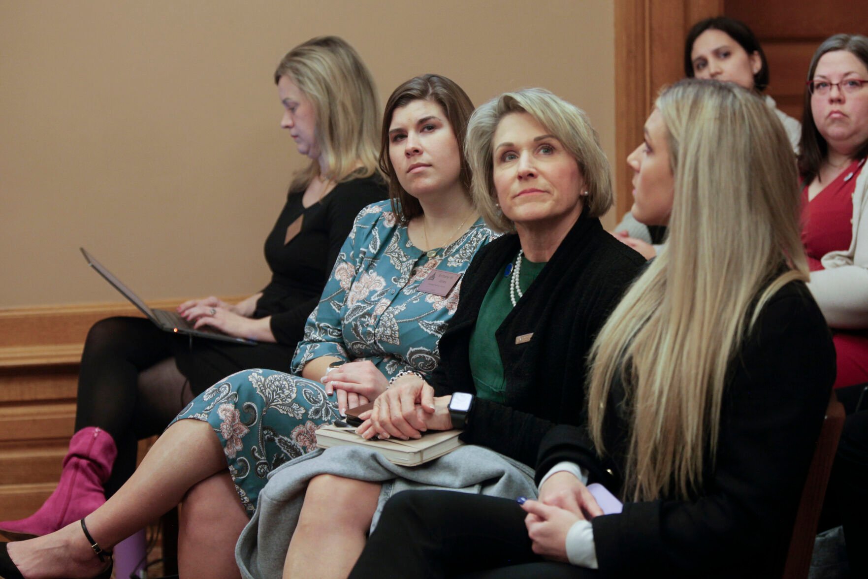 <p>Kansas state Rep. Barb Wasinger, center, R-Hays, watches a Kansas Senate health committee hearing on a proposal to define male and female in Kansas law based on people's anatomy at birth Wednesday at the Statehouse in Topeka, Kan. She's flanked by, left, Brittany Jones, attorney and lobbyist for the conservative group Kansas Family Voice, and right, Riley Gaines, a former University of Kentucky swimmer who's spoken against allowing transgender athletes to compete in girls' and women's sports.</p>