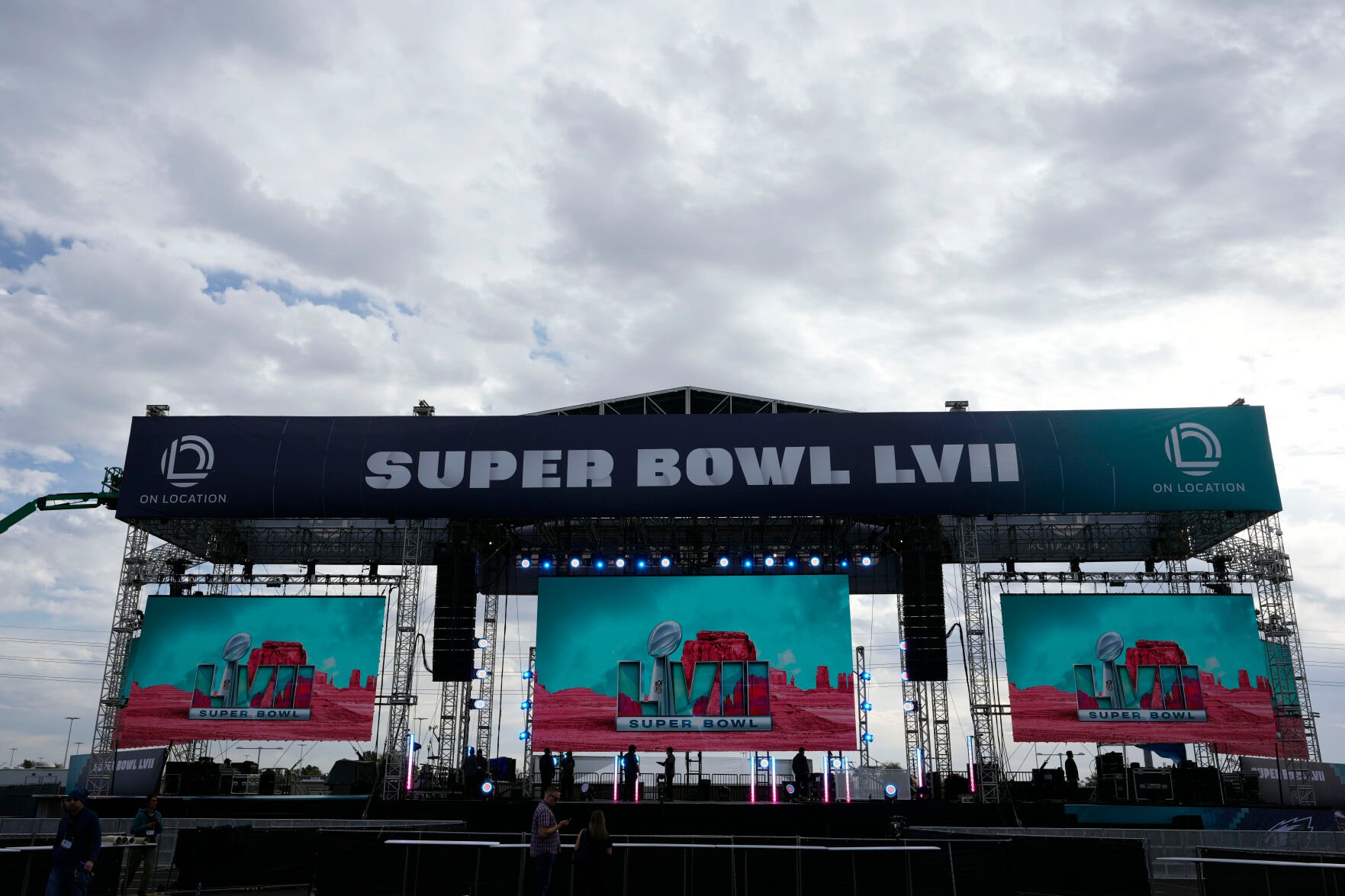 <p>Logos are flashed on a stage outside State Farm Stadium ahead of Super Bowl 57 on Saturday in Glendale, Ariz. The Kansas City Chiefs will play the Philadelphia Eagles on Sunday.</p>