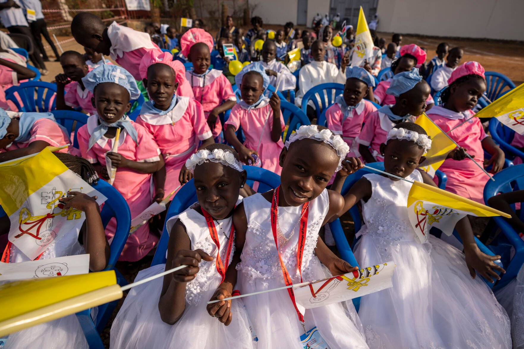 <p>Young girls await the arrival of Pope Francis on Saturday at the St. Theresa Cathedral in Juba, South Sudan.</p>
