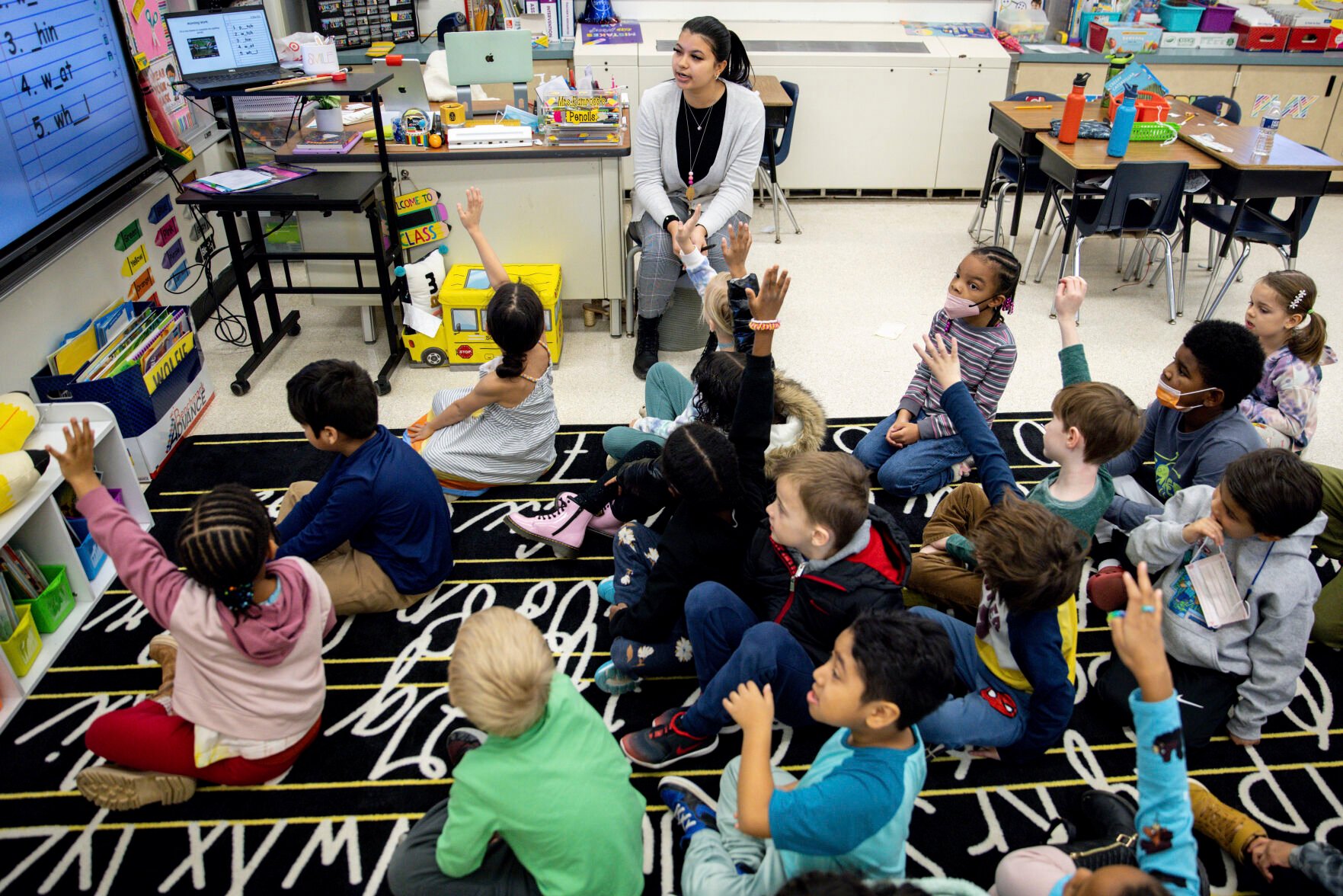 <p>Christine Ramroop, who graduated from Bowie State University in 2020, teaches first graders during their warm-up for the day at Whitehall Elementary School, Tuesday, Jan. 24, 2023, in Bowie, Md. </p>