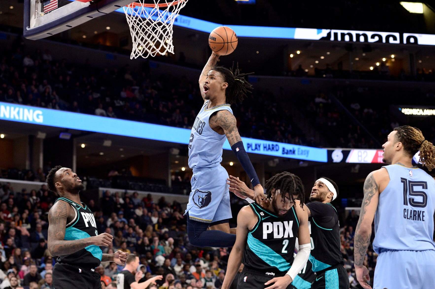 <p>Memphis Grizzlies guard Ja Morant goes up for a dunk over Portland Trail Blazers forward Trendon Watford in the second half Wednesday's game in Memphis, Tenn.</p>