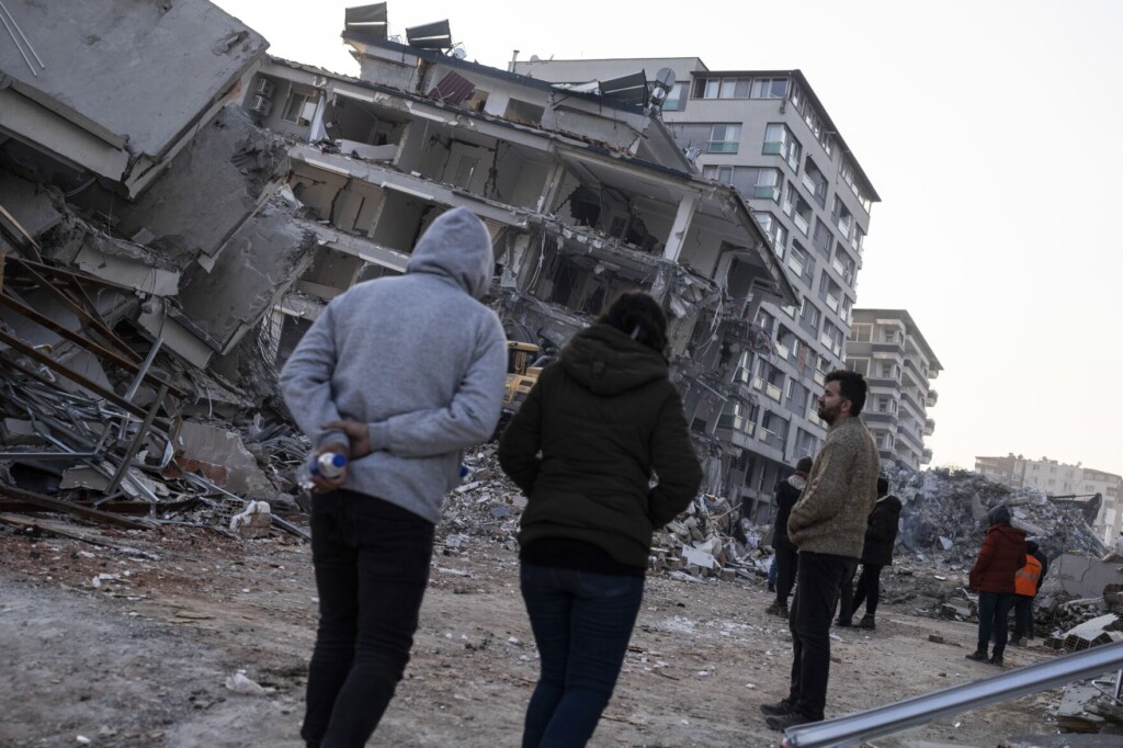 Quake Survivors Wait Amid Rubble, To Search Or Say Goodbye