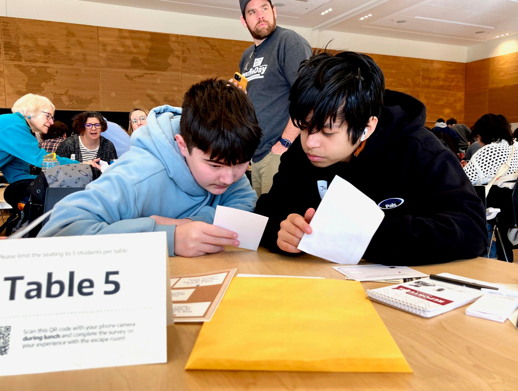 <p>Meadowdale High School 9th grade students Juanangel Avila, right, and Legacy Marshall, left, work together to solve an exercise March 14 at MisinfoDay, an event hosted by the University of Washington to help high school students identify and avoid misinformation, in Seattle.</p>