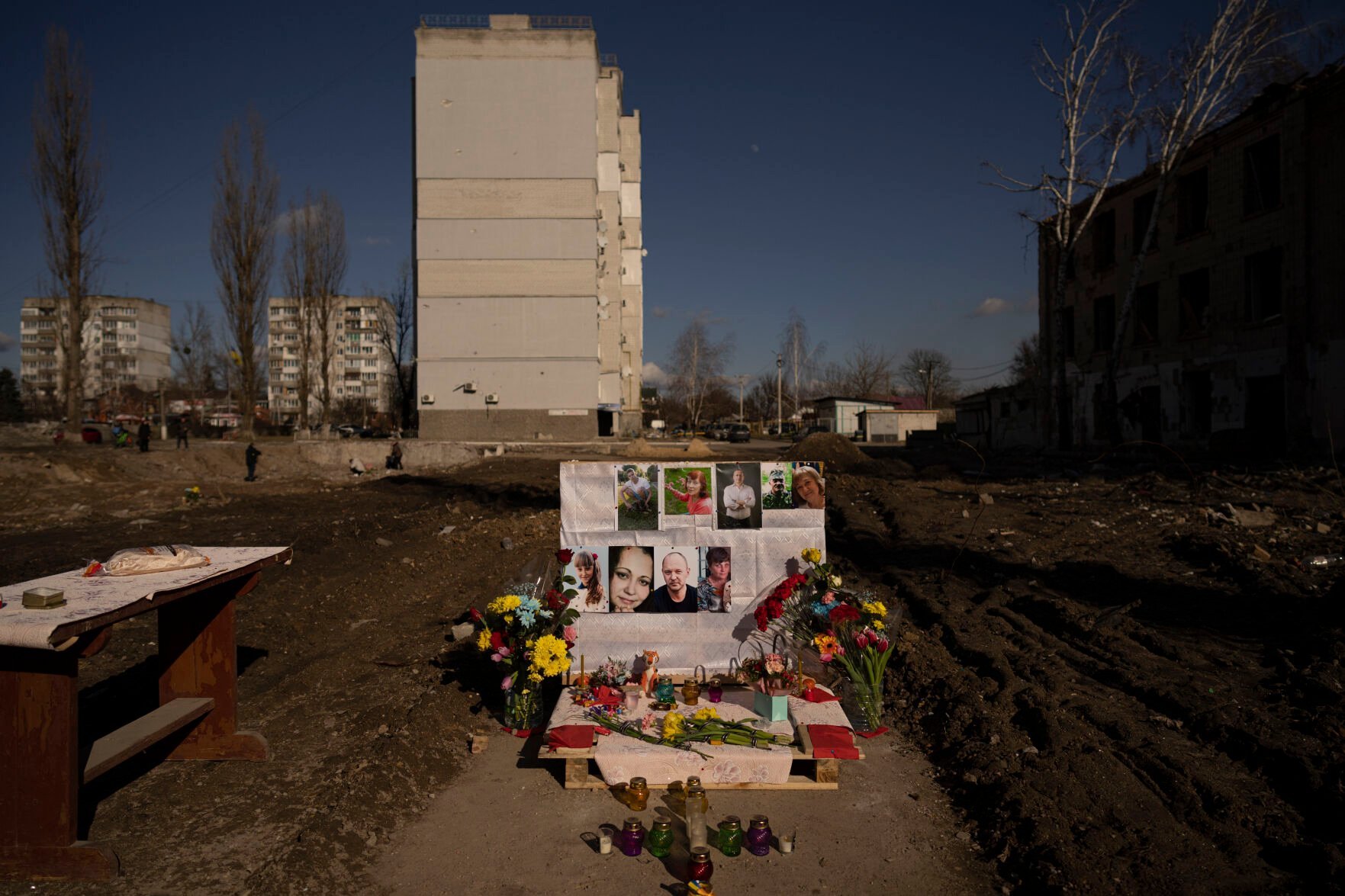<p>Pictures of victims are placed on a makeshift memorial for those killed on the place of a building demolished after being heavily damaged by an airstrike, one year ago, in Borodyanka, Ukraine, Thursday, March 2, 2023. On Friday, March 3, 2023, The Associated Press reported on stories circulating online incorrectly claiming the U.S. only supports Ukraine through donated military equipment, not cash assistance. (AP Photo/Vadim Ghirda)</p>
