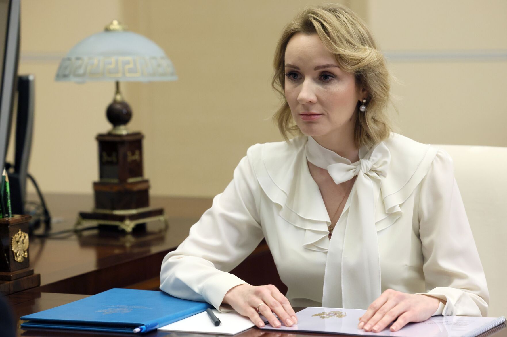 <p>Russian Presidential Commissioner for Children's Rights Maria Lvova-Belova speaks to Russian President Vladimir Putin at the Novo-Ogaryovo state residence, outside Moscow, Russia, on Feb. 16.</p>