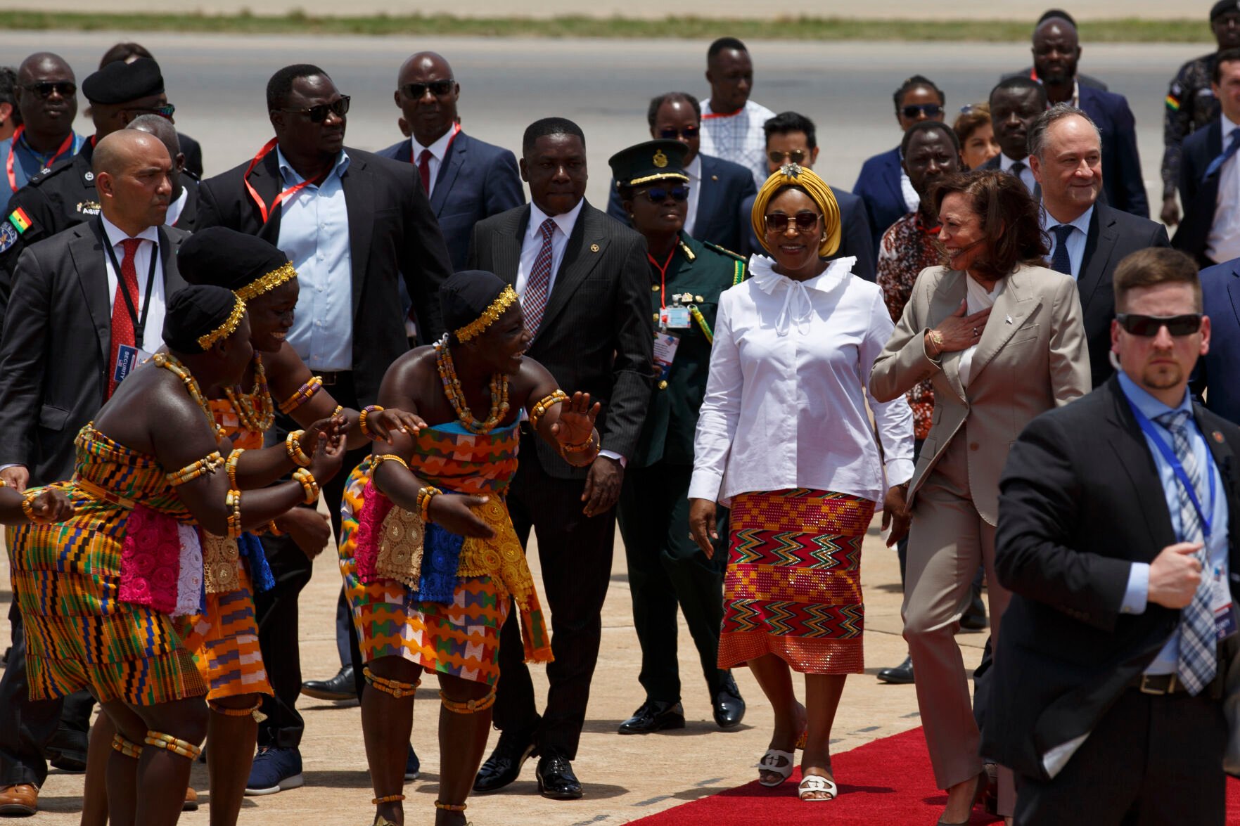 <p>U.S. Vice President Kamala Harris is greeted by traditional dancers as she arrives Sunday in Accra, Ghana.</p>