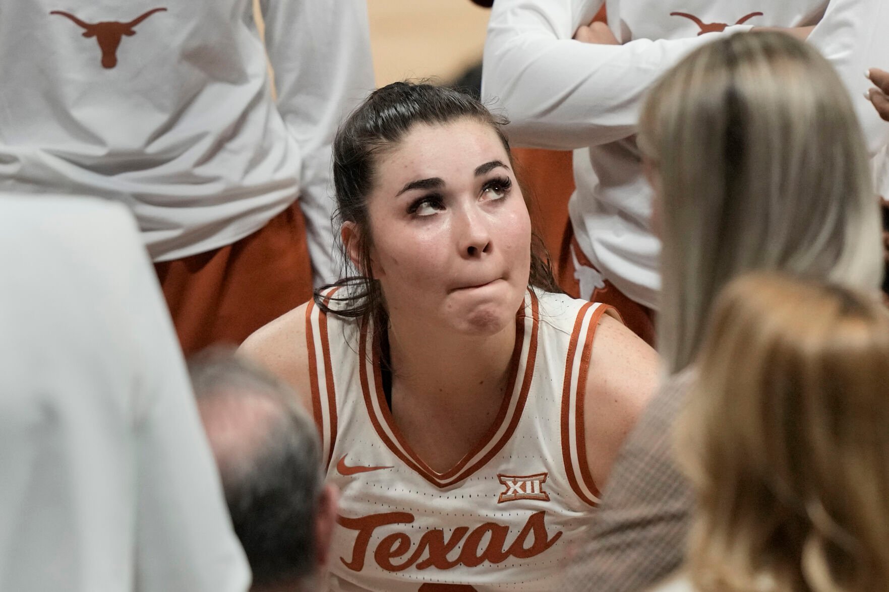 <p>Texas guard Shaylee Gonzales huddles with teammates during a game against Kansas State on March 10.</p>