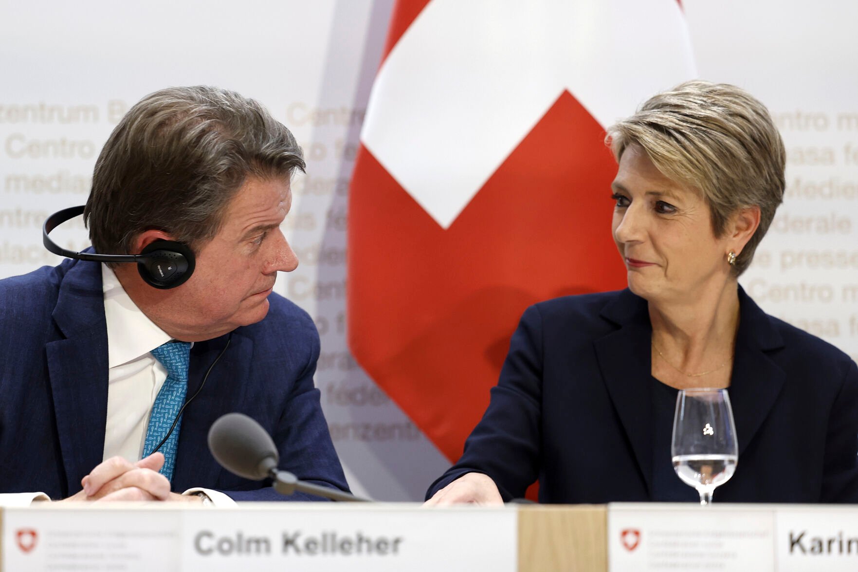 <p>Colm Kelleher, the chairman of UBS, left, and Swiss Finance Minister Karin Keller-Sutter, confer during a press conference Sunday in Bern, Switzerland.</p>