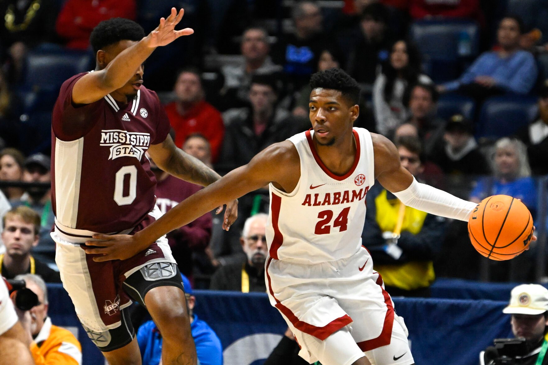 <p>Alabama forward Brandon Miller, right, moves around Mississippi State forward DJ Jeffries during the first half of Friday's SEC third round game in Nashville, Tenn.</p>