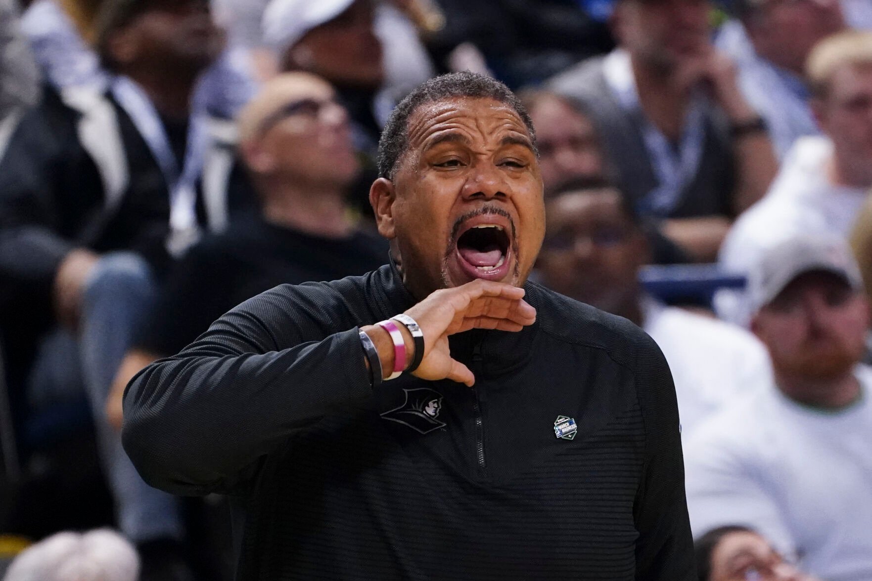 <p>Providence head coach Ed Cooley shouts to his players on the court during the second half of Friday's first round game against Kentucky in the NCAA Tournament in Greensboro, N.C.</p>