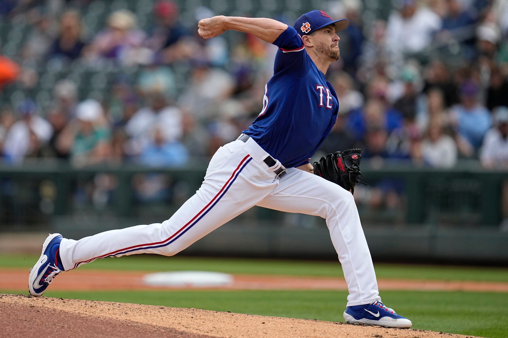 <p>Texas Rangers starting pitcher Jacob deGrom, shown throwing in a Spring Training Game on March 19, will get the starting nod against Philadelphia Phillies starting pitcher Aaron Nola on Opening Day.</p>
