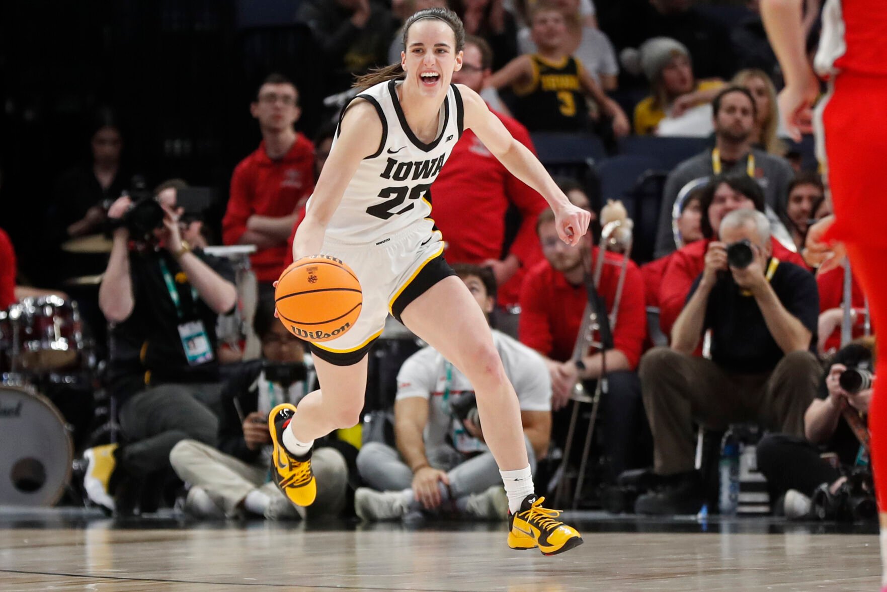 <p>Iowa guard Caitlin Clark smiles after catching her 10th rebound to give her a triple-double against Ohio State on March 5.</p>