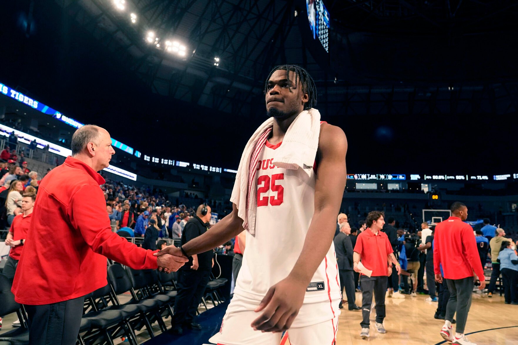 <p>Houston forward Jarace Walker walks off the court after Sunday's loss to Memphis in the finals of the American Athletic Conference Tournament in Fort Worth, Texas.</p>