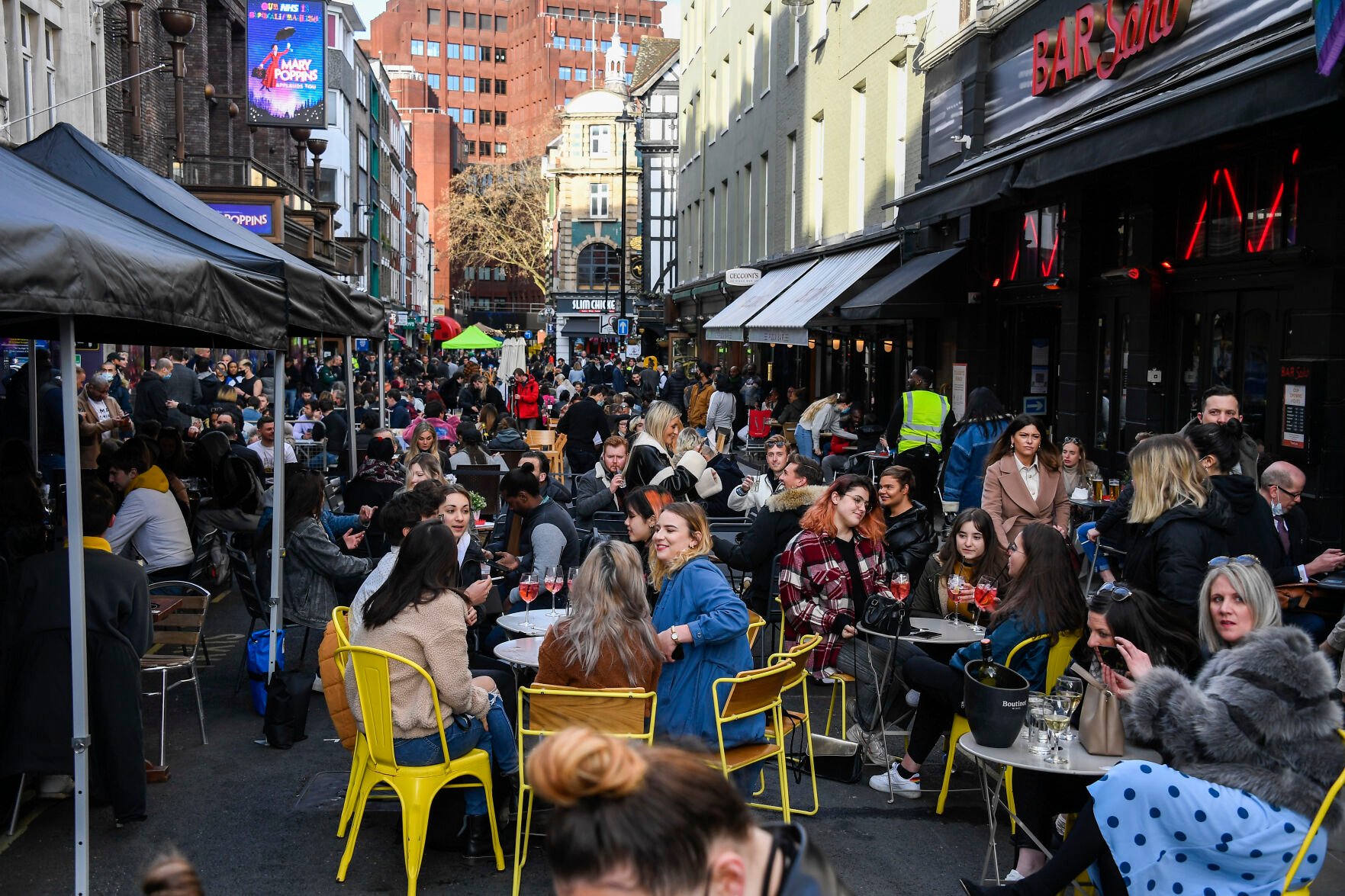 <p>FILE - People sit, drinking and eating, outside cafes and pubs Soho, central London, April 12, 2021. Greenhouse gas emissions from the way humans consume food could add nearly one degree of warming to the Earth’s climate by 2100, according to a new study Monday, March 6, 2023. Researchers found that the majority of greenhouse gas emissions come from three major food groups — meat from animals like cows, sheep and goats, dairy and rice. (AP Photo/Alberto Pezzali, File)</p>