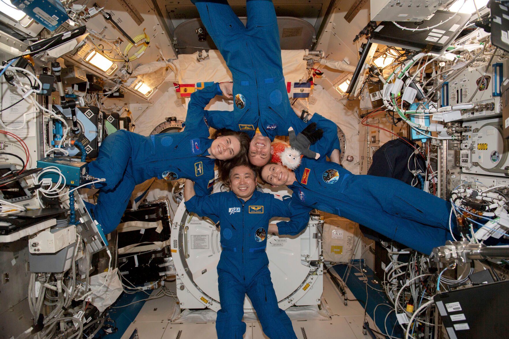 <p>Clockwise from left, Expedition 68 flight engineers Anna Kikina of Roscosmos, Josh Cassada and Nicole Mann from NASA, and Koichi Wakata of the Japan Aerospace Exploration Agency gather for a portrait March 1 inside the International Space Station's Kibo laboratory module.</p>