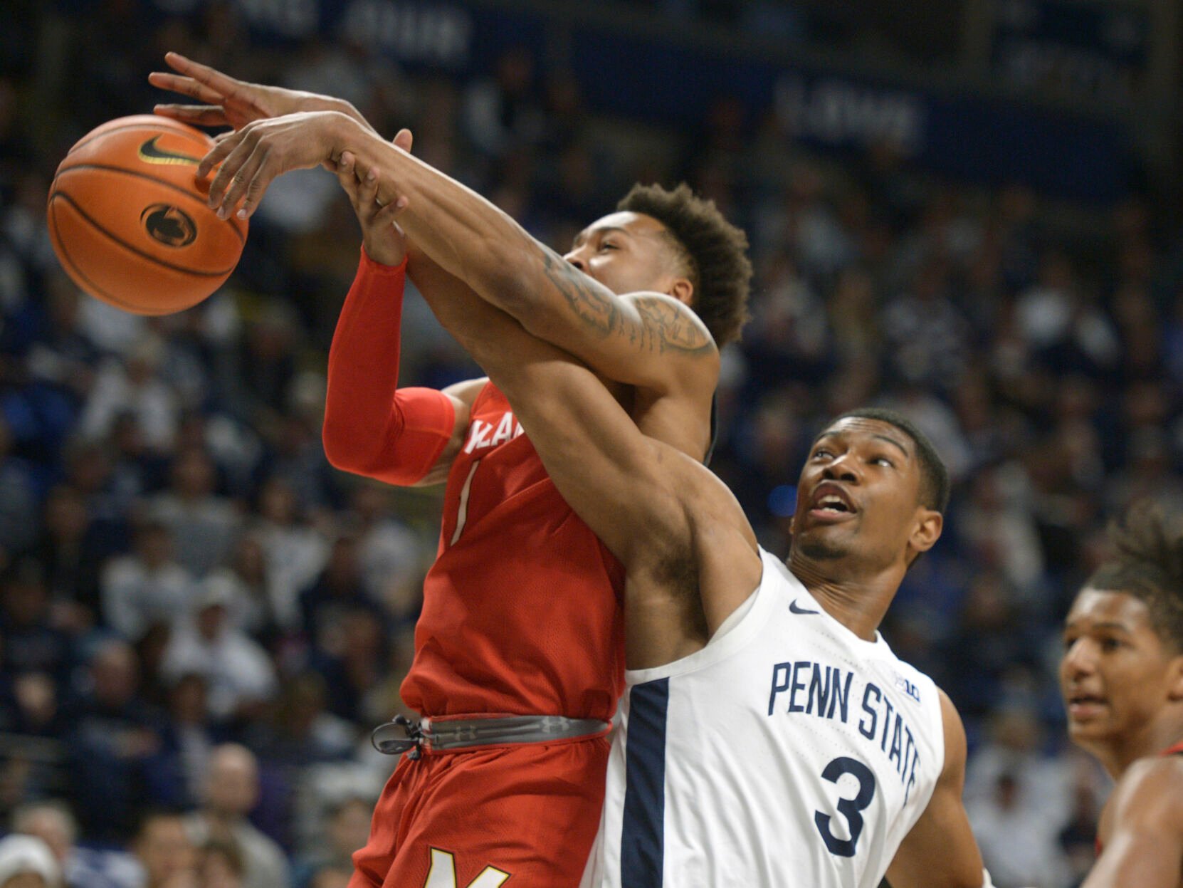 <p>Maryland's Jahmir Young,left, and Penn State's Kebba Njie (3) battle for a rebound during the first half of an NCAA college basketball game, Sunday, March 5, 2023, in State College, Pa. (AP Photo/Gary M. Baranec)</p>