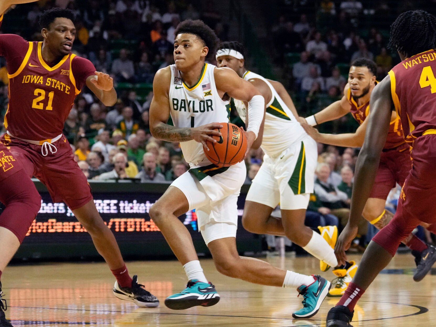 <p>Baylor guard Keyonte George drives to the basket past Iowa State center Osun Osunniyi during their March 4 game.</p>