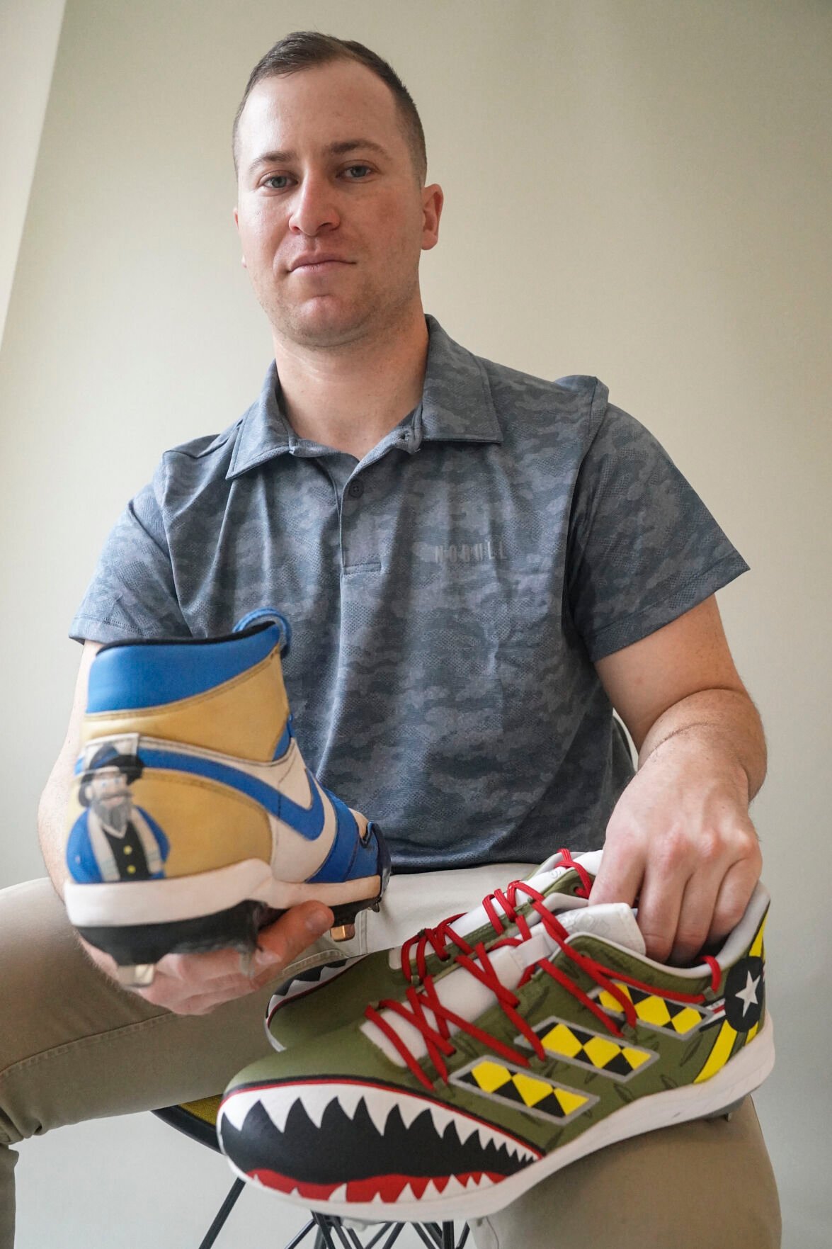 <p>Baseball player Alex Katz shows off his custom cleats on March 1 in New York. Many players in this year's World Baseball Classic—where Katz is a pitcher on Israel's team, will be wearing custom-designed cleats produced by his company Stadium Custom Kicks.</p>