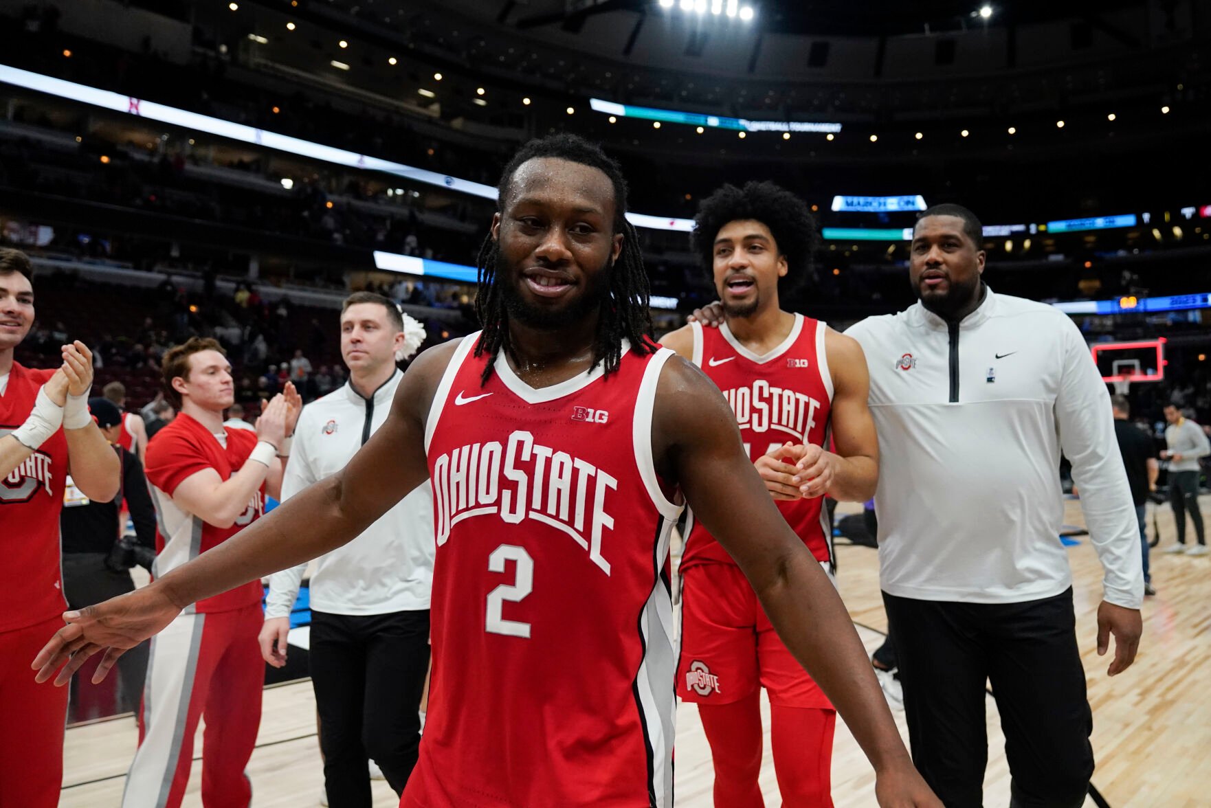 <p>Ohio State's Bruce Thornton, front, and his teammates celebrate after beating Michigan State in the quarterfinals of the Big Ten conference tournament on Friday in Chicago.</p>