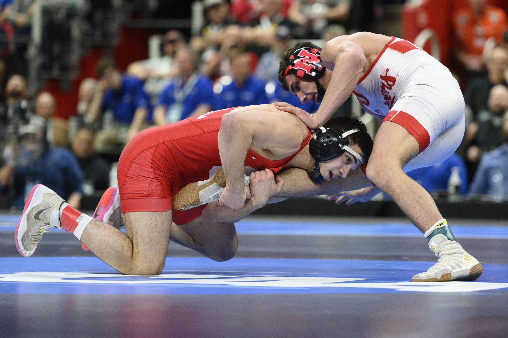 <p>Cornell's Yianni Diakomihalis, left, scores a takedown on Nebraska's Ridge Lovett during their 149-pound match at the NCAA Division I wrestling championships last March. Diakomihalis is seeking his fourth national titles at this year's championships starting Thursday in Tulsa, Okla.</p>