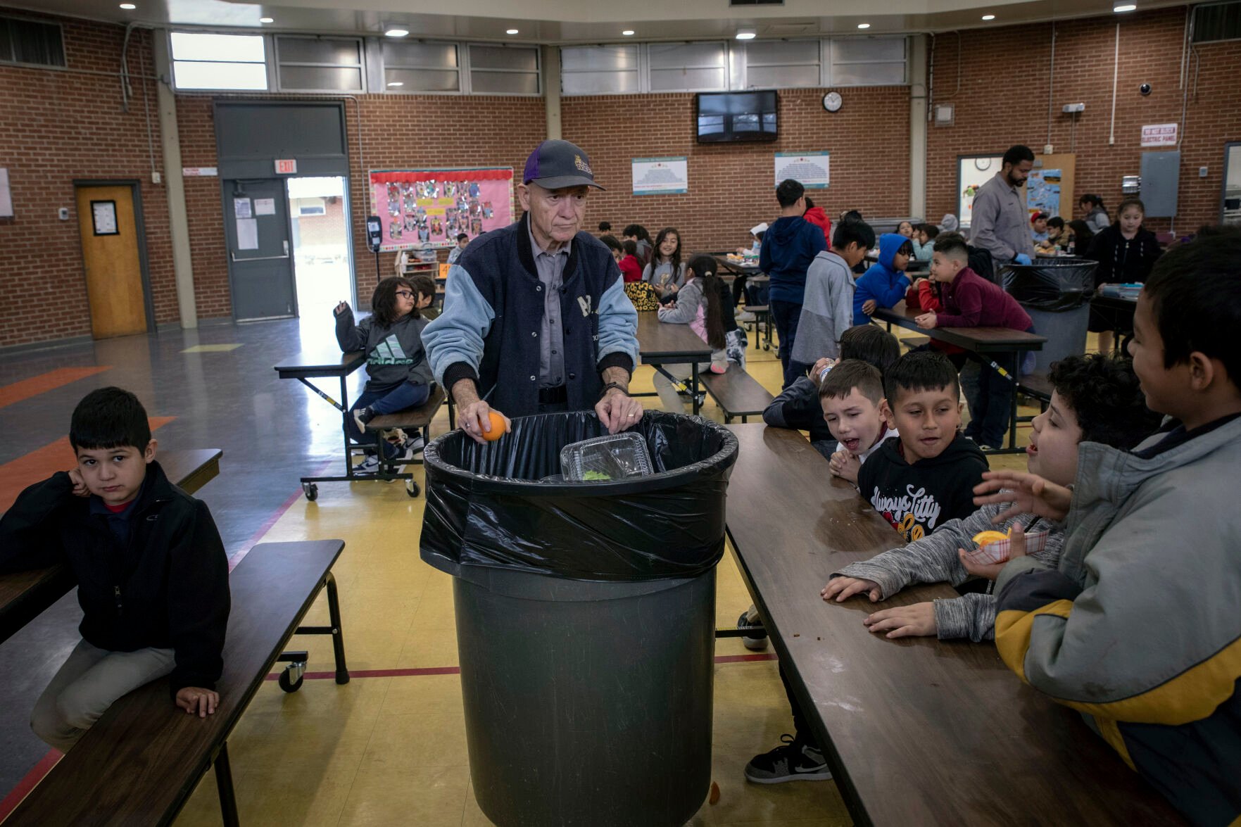 <p>Students dispose of their unfinished food at the end of lunch break Jan. 31 at V. H. Lassen Academy of Science and Nutrition in Phoenix.</p>