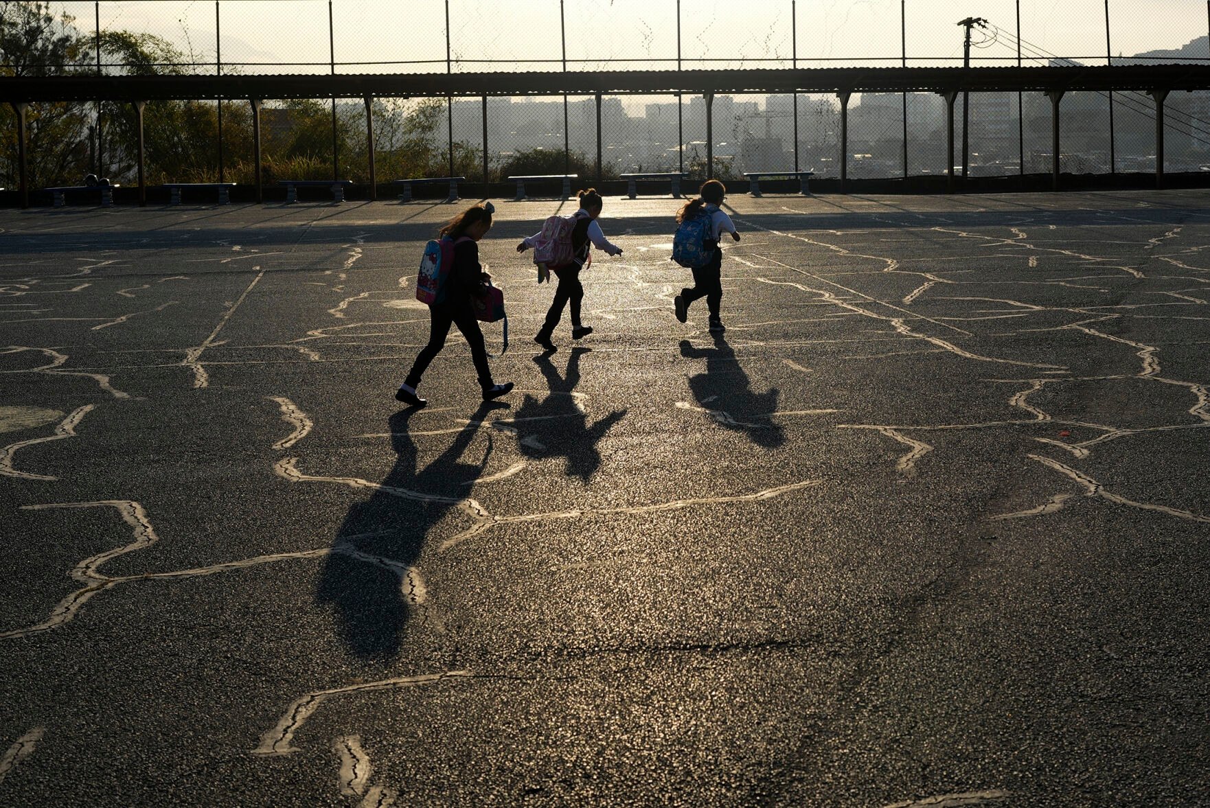 <p>Students rush to get to school on time Feb. 27 in Caracas, Venezuela.</p>