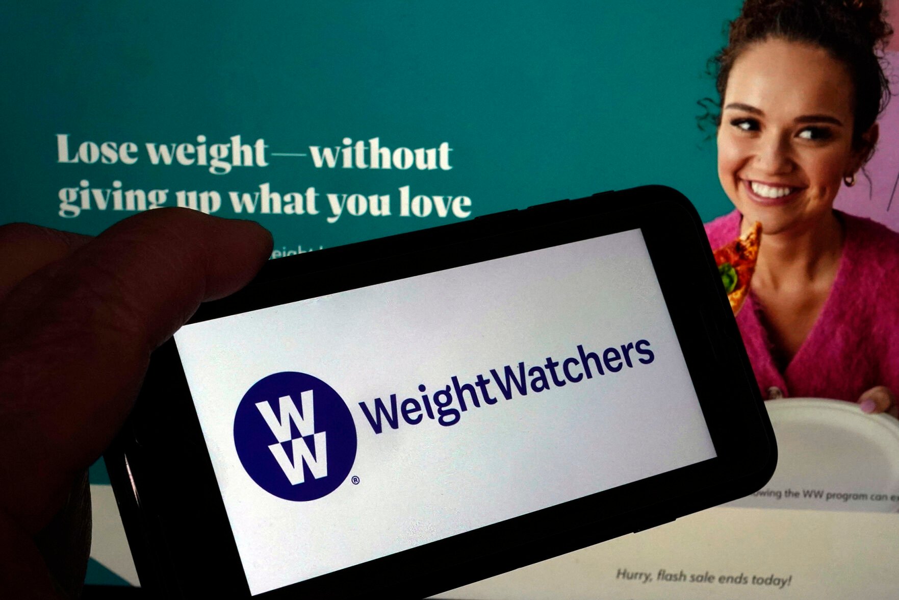 <p>This image shows the logo of WeightWatchers on a mobile phone and the company's website Tuesday in New York.</p>