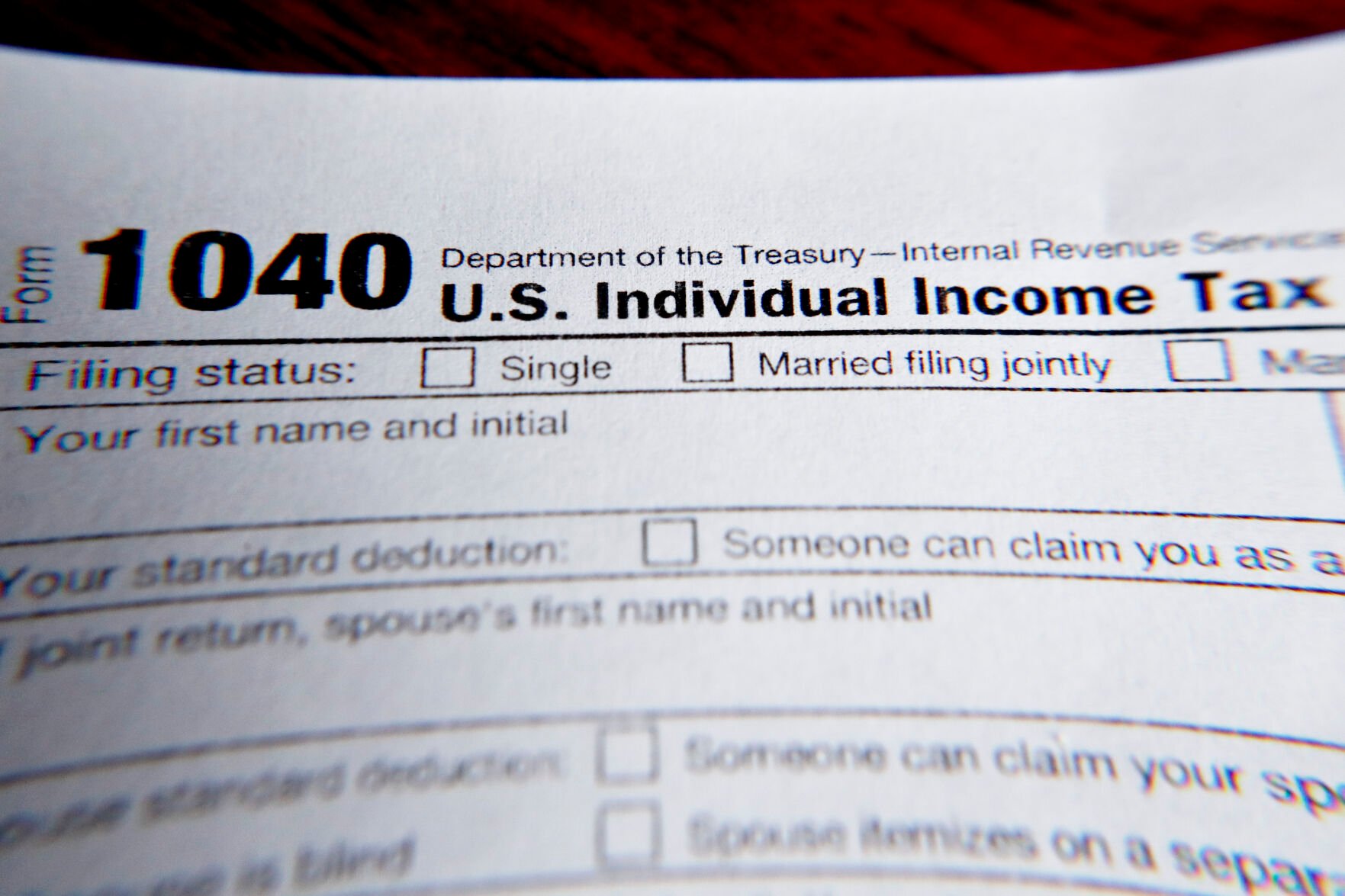 <p>FILE - This Feb. 13, 2019 file photo shows part of a 1040 federal tax form printed from the Internal Revenue Service website, in Zelienople, Pa. It’s the first quarter of the year, and many people may be interested in starting side hustles for extra income or to finally pursue their entrepreneurial dreams. Whatever the motivation, it’s important to know the implications of starting a side gig while having a 9-to-5 job. This includes understanding how to plan for taxes, budgeting for your side income and deciding how you want your money to work for you. (AP Photo/Keith Srakocic, File)</p>