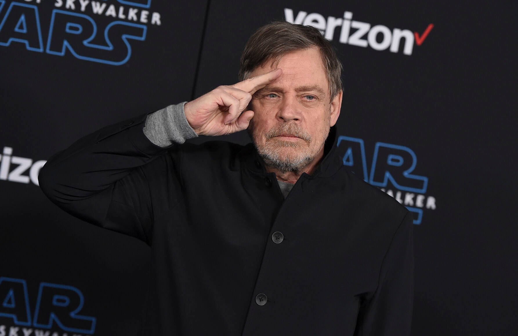 <p>Mark Hamill salutes as he arrives at the world premiere of "Star Wars: The Rise of Skywalker" on Dec. 16, 2019 in Los Angeles.</p>